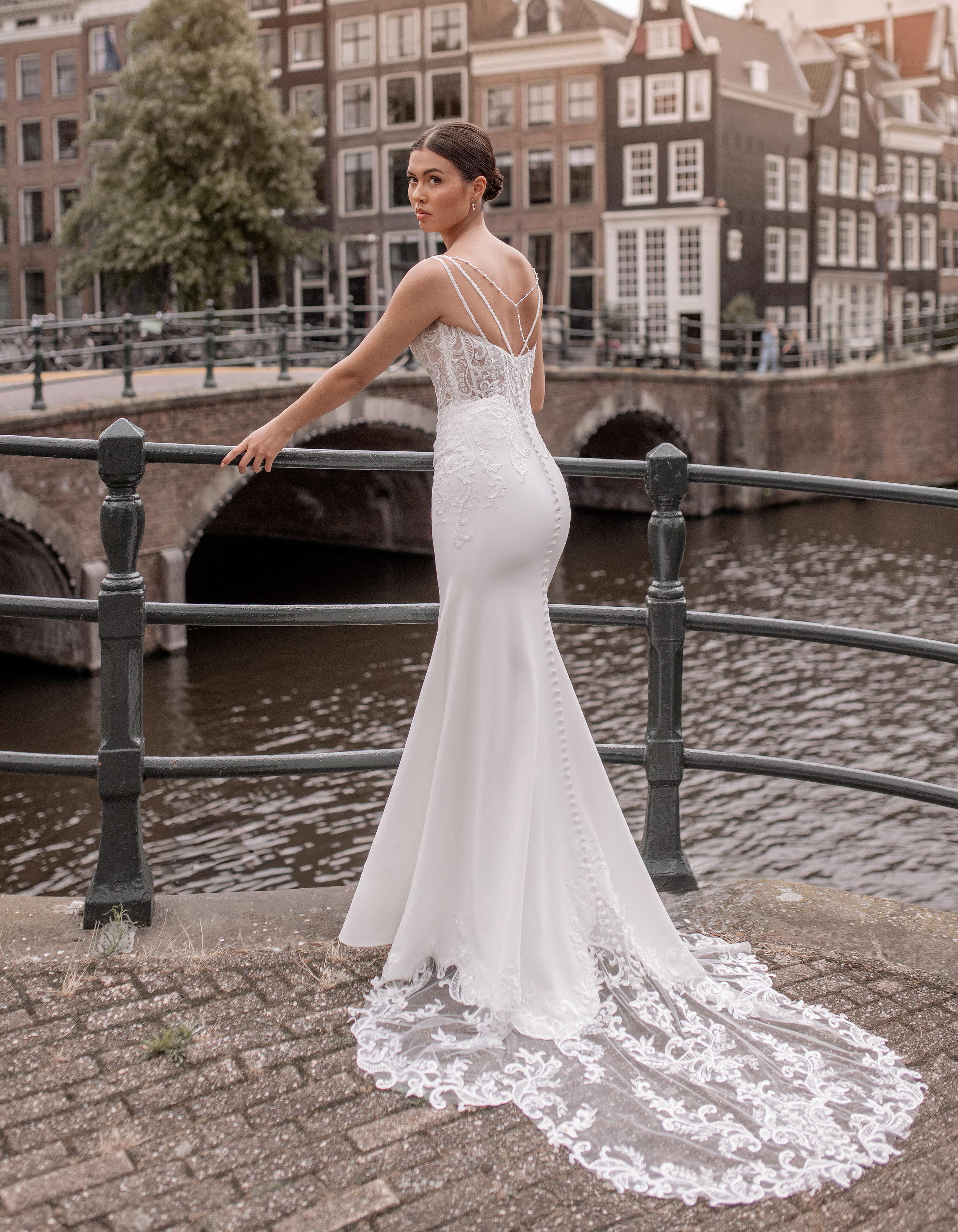 Bates - <div>a daring sheath with on-trend basque waist</div>