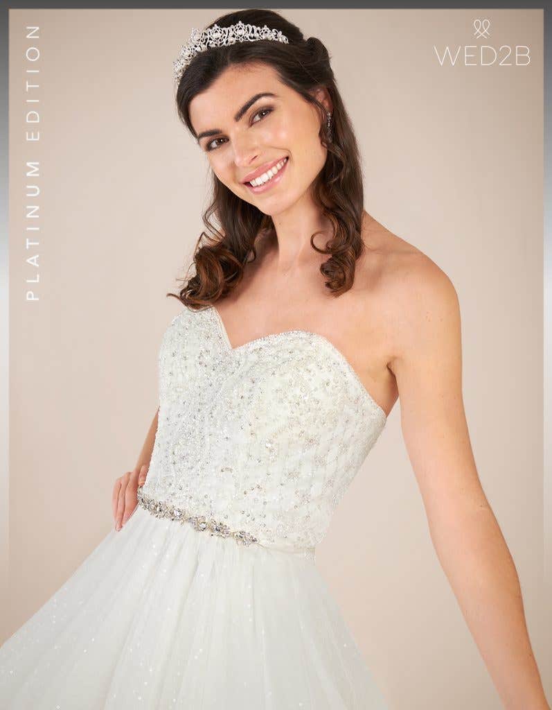 Close-up front view of Glitz by Viva Bride, a stunning lace wedding dress