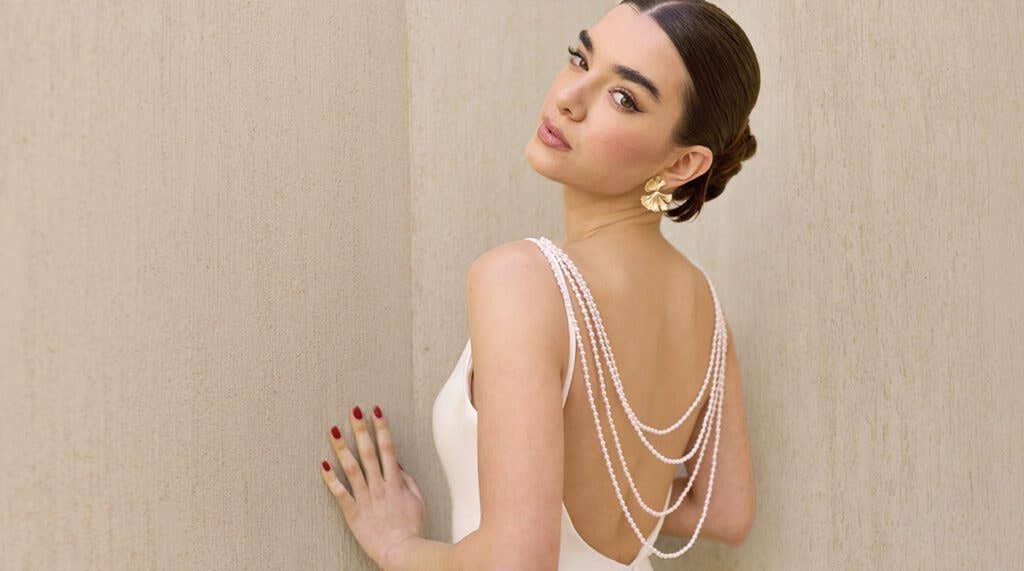 Here's why backless wedding dresses are big news…