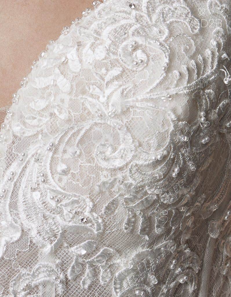 Detail view of wedding dress with straps Syrah