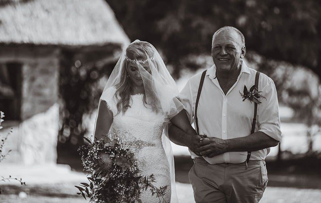 Walking down the aisle at their safari wedding