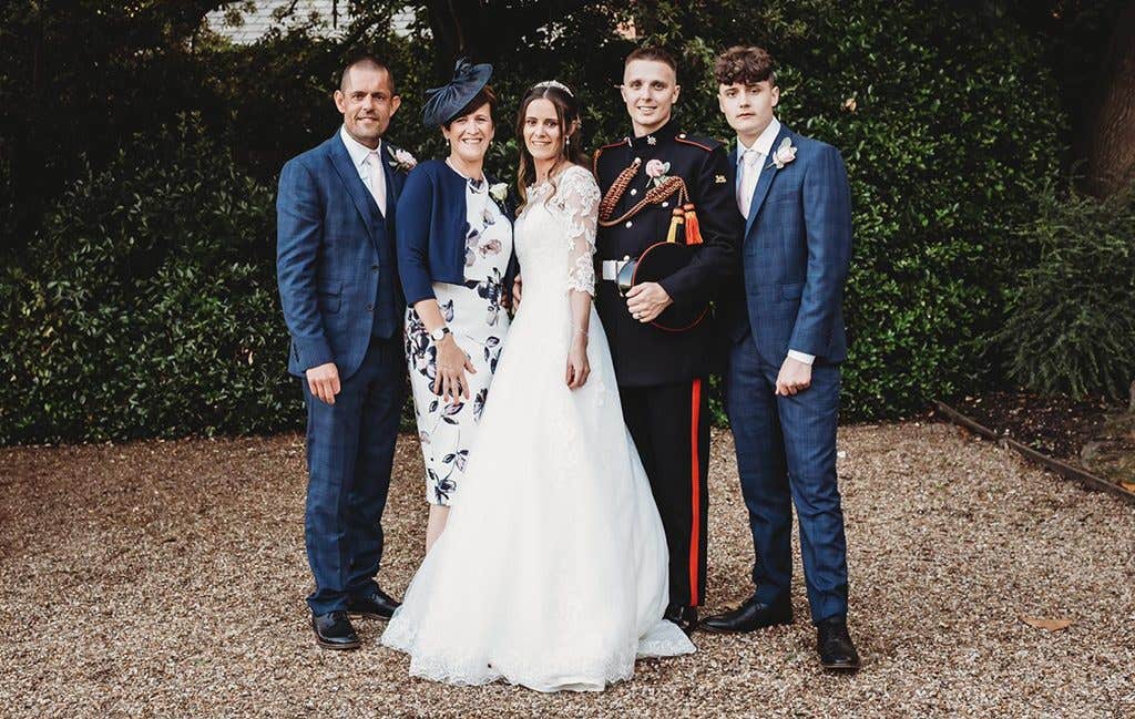 The happy couple and their family at their townhouse wedding
