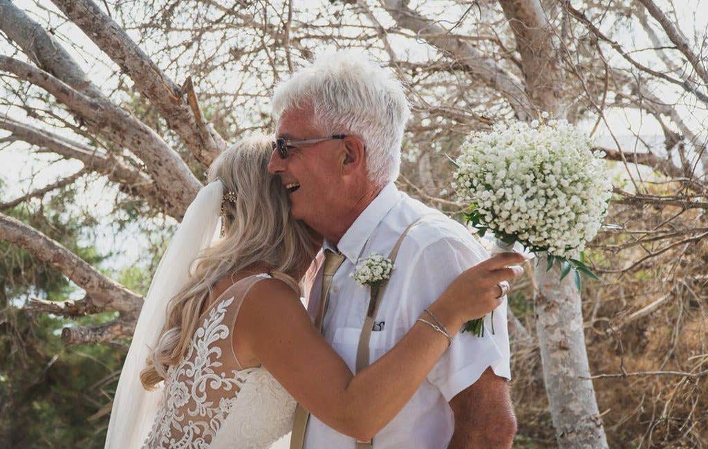 The happy bride and family at her Ibiza wedding