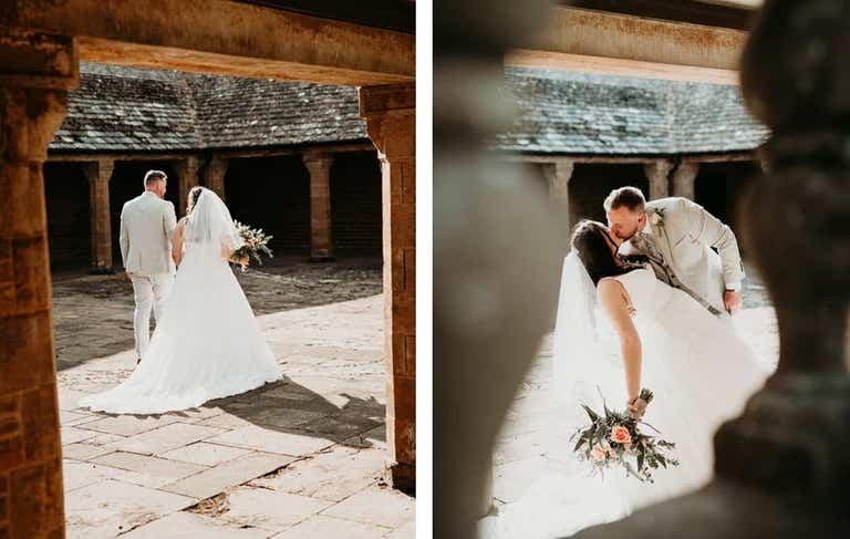Bride and groom holding hands walking away, kissing outside barn