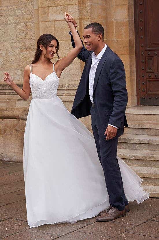 Full front image of Jonie a traditional A-line wedding dress with lace and organza