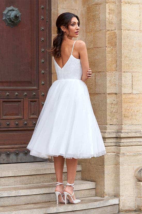 Full back image of Sofia a bouncy short wedding dress with glitter tulle