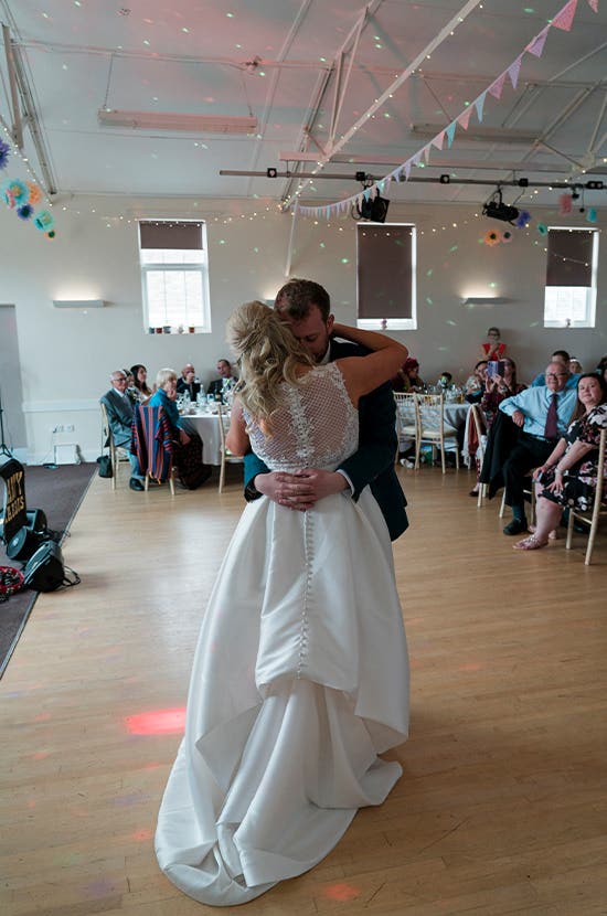 Bride and Groom embracing on the dancefloor