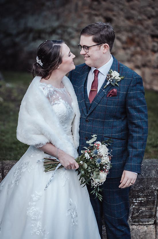 Rhiannon and Edward smiling at one another