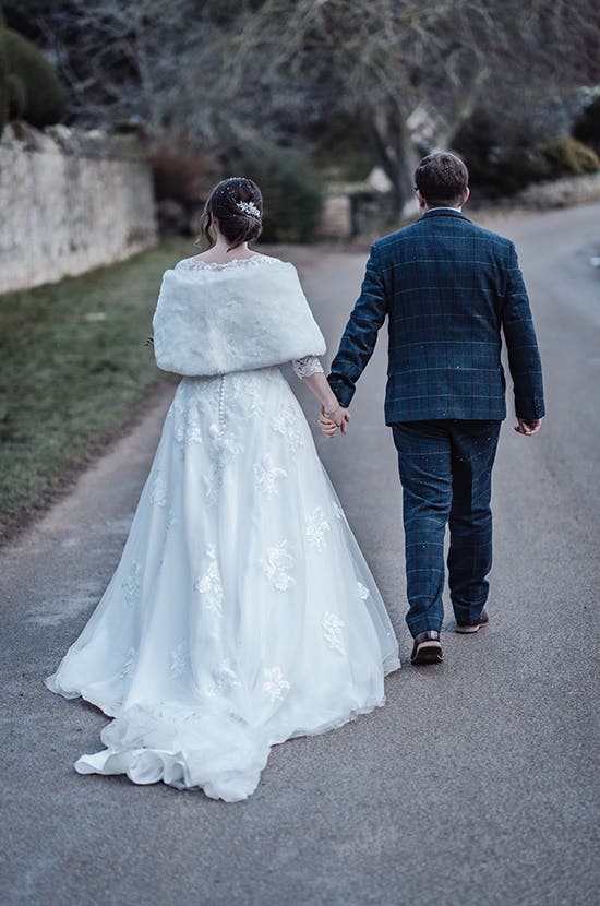 Rhiannon and Edward walking holding hands