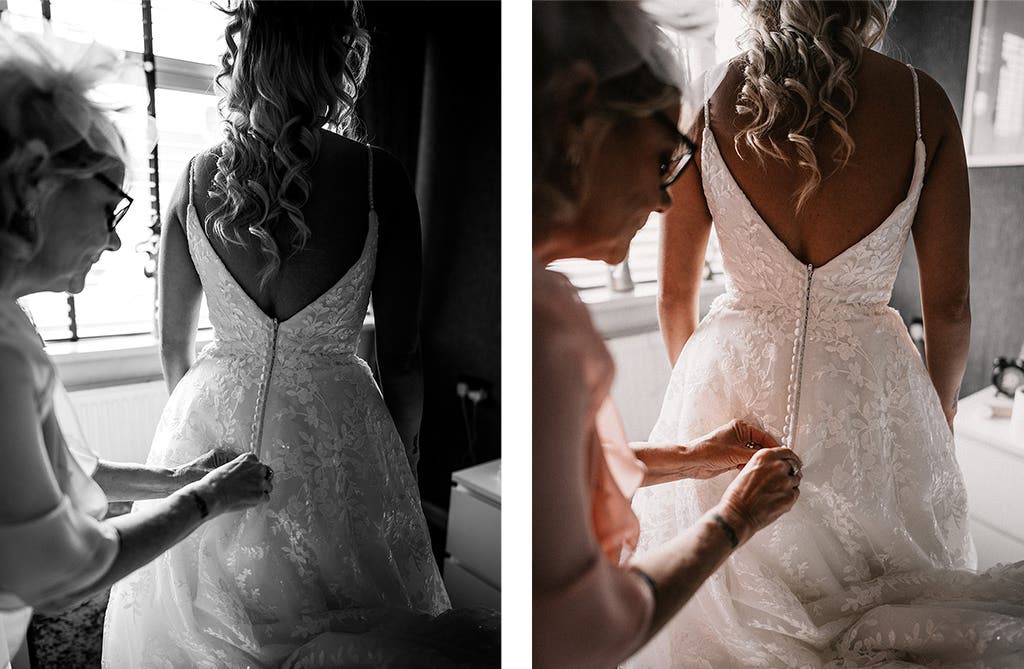 Back of Sophie’s lace wedding dress with buttons being looped and fastened