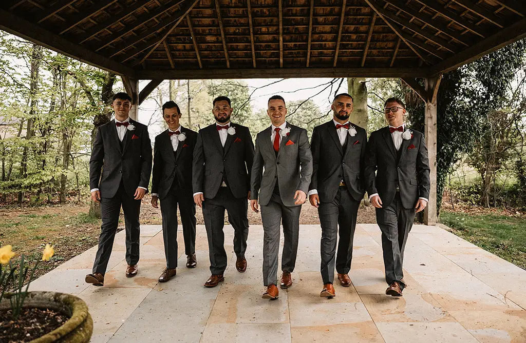 Dean with his groomsmen outside the wedding venue