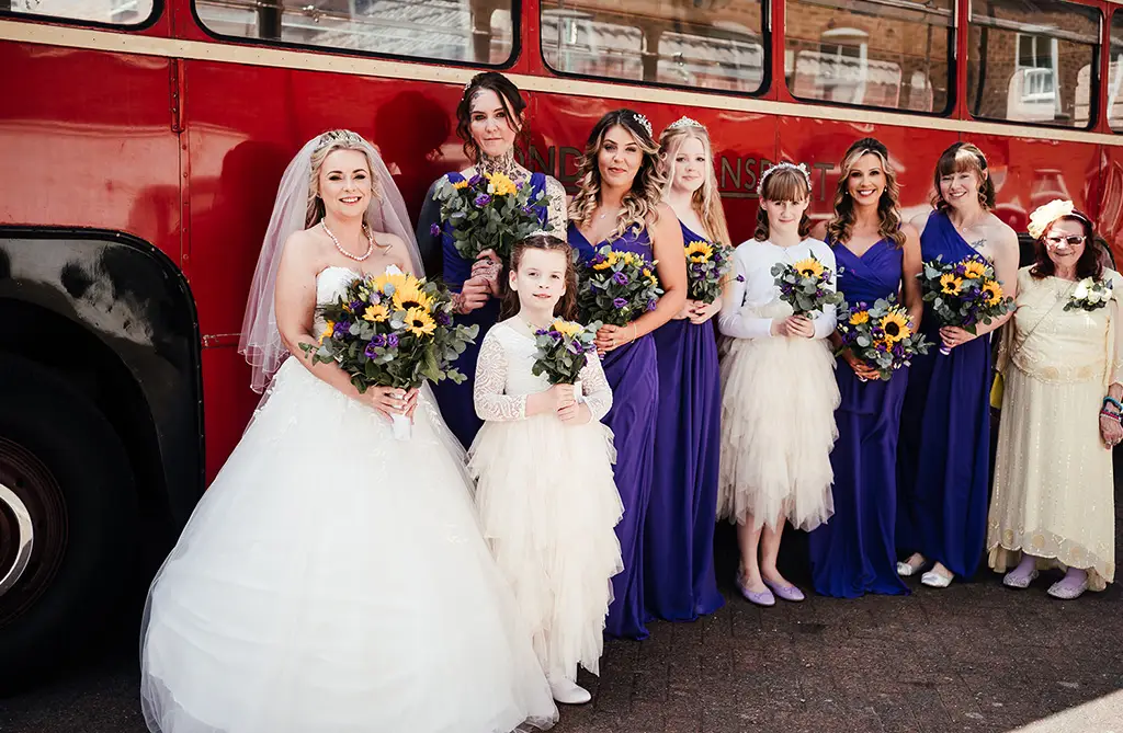 Tracey with her bridesmaids and flower girls at her church and country wedding