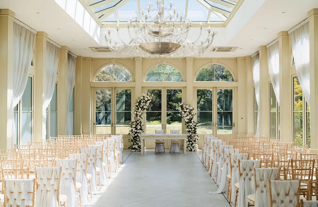 Spring floral arch ceremony setting from Ellie and Joey’s wedding
