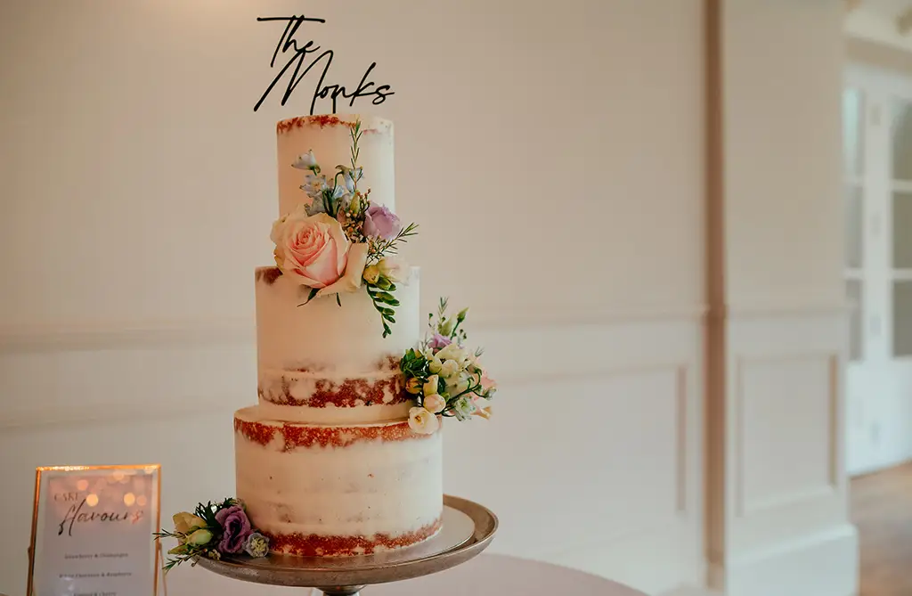 Naked spring wedding cake with floral decoration