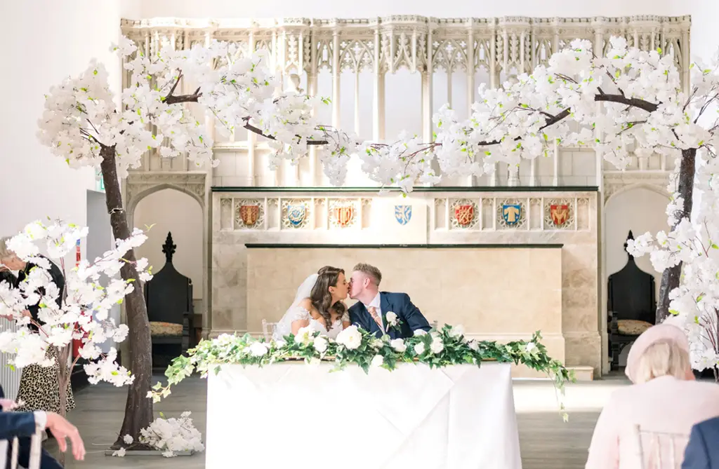 Artificial blossom tree ceremony decor for a spring wedding