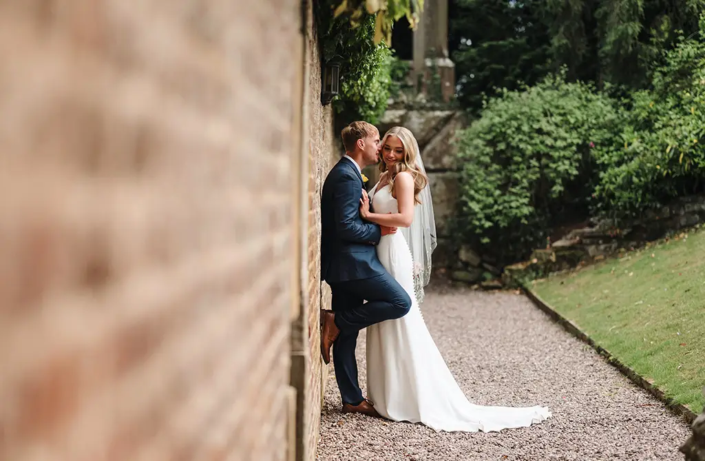 Bride and groom at a romantic spring barn wedding at Soughton Hall