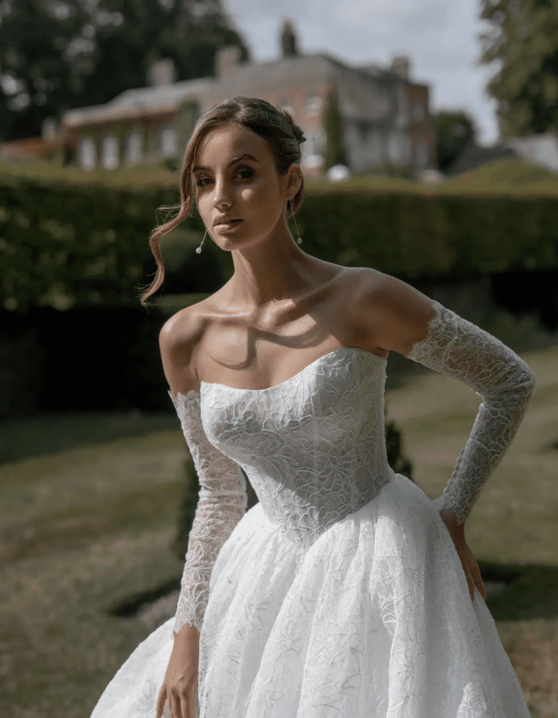 Statement bridal gown with bold silhouette and modern neckline detail