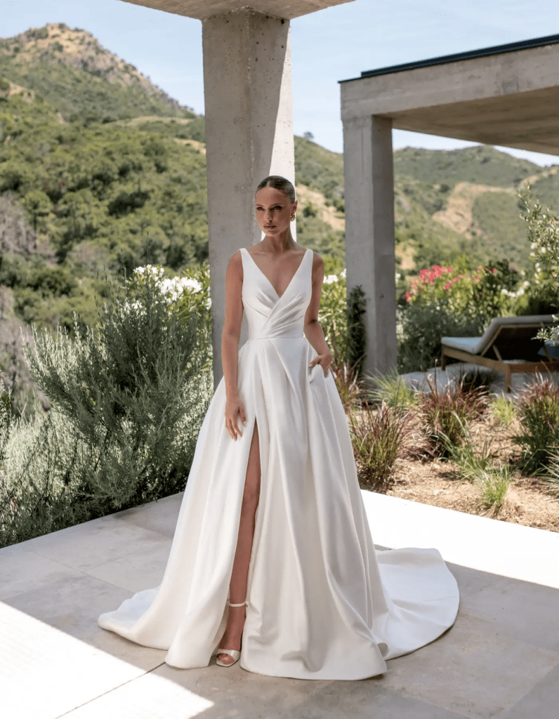 Dramatic fashion-forward wedding dress with full ballgown skirt and structured bodice