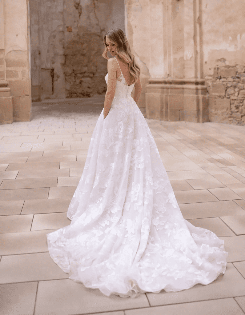 Runway-inspired bridal gown with flowing fabric and voluminous silhouette