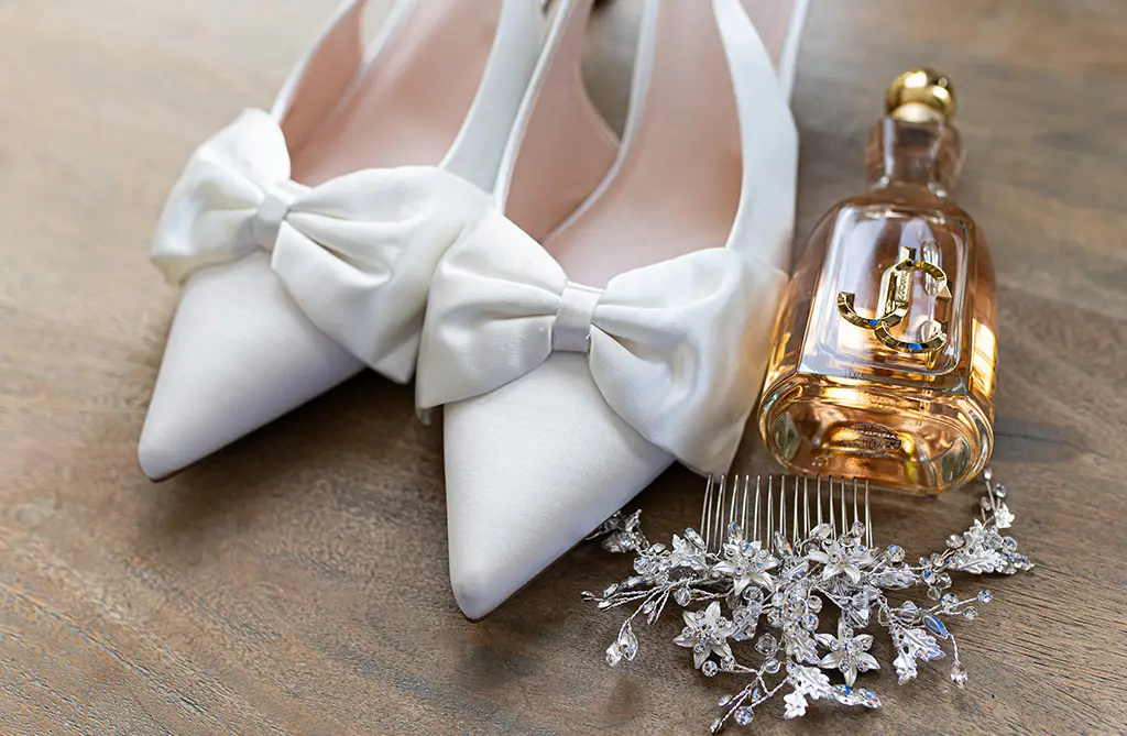 Real bride in a Sofia Cruz wedding dress with sleek bridal accessories and modern veil