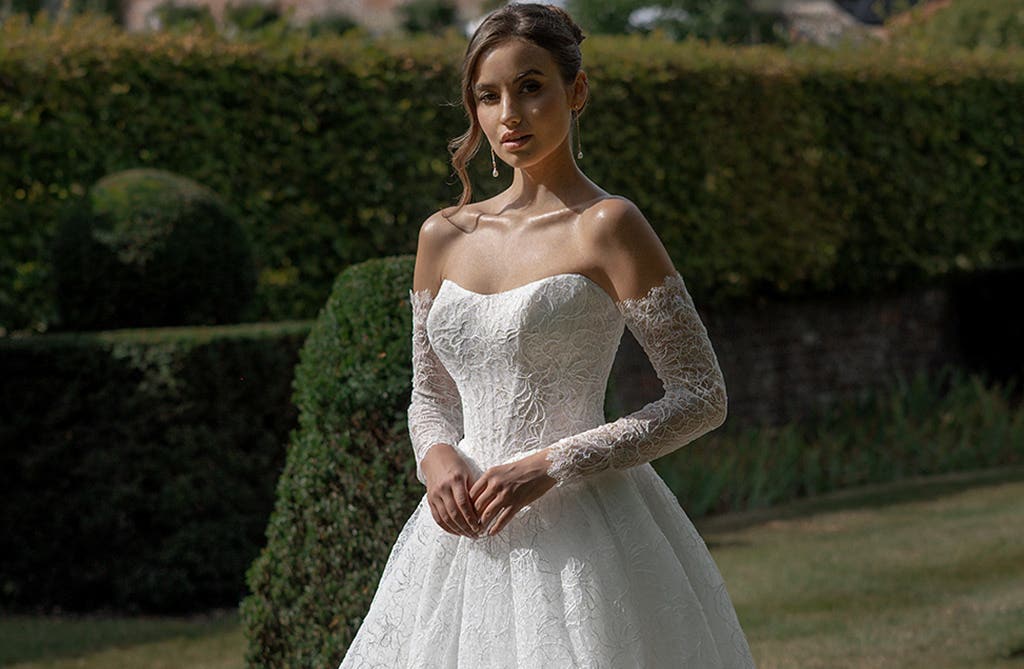 Fashion-forward ballgown wedding dress with dramatic skirt and structured bodice