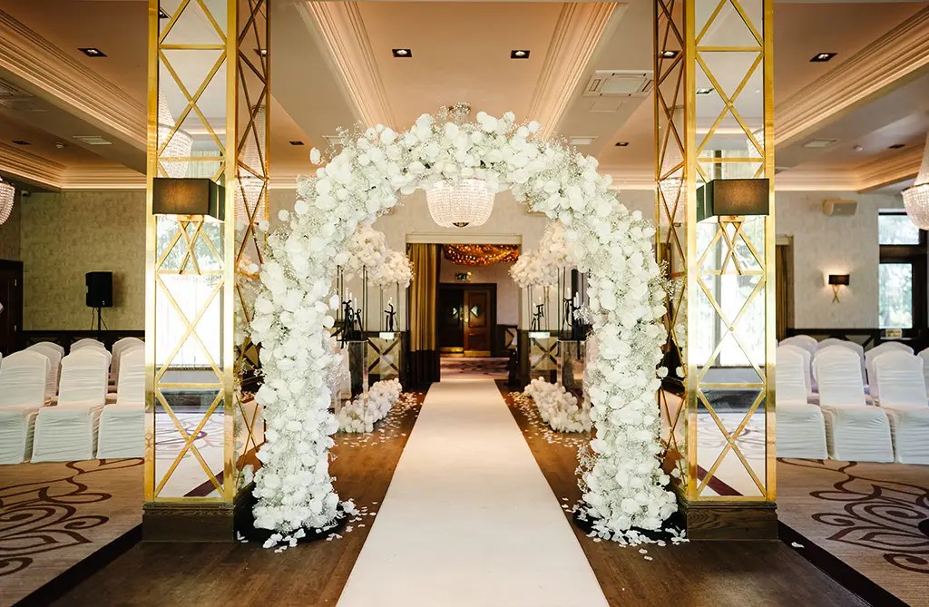 Kristeen and Ryan’s floral arches at their wedding ceremony
