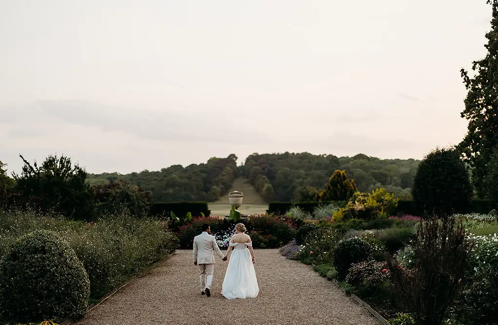 Fran and Ronit walking through the grounds of Ragley Hall holding hands