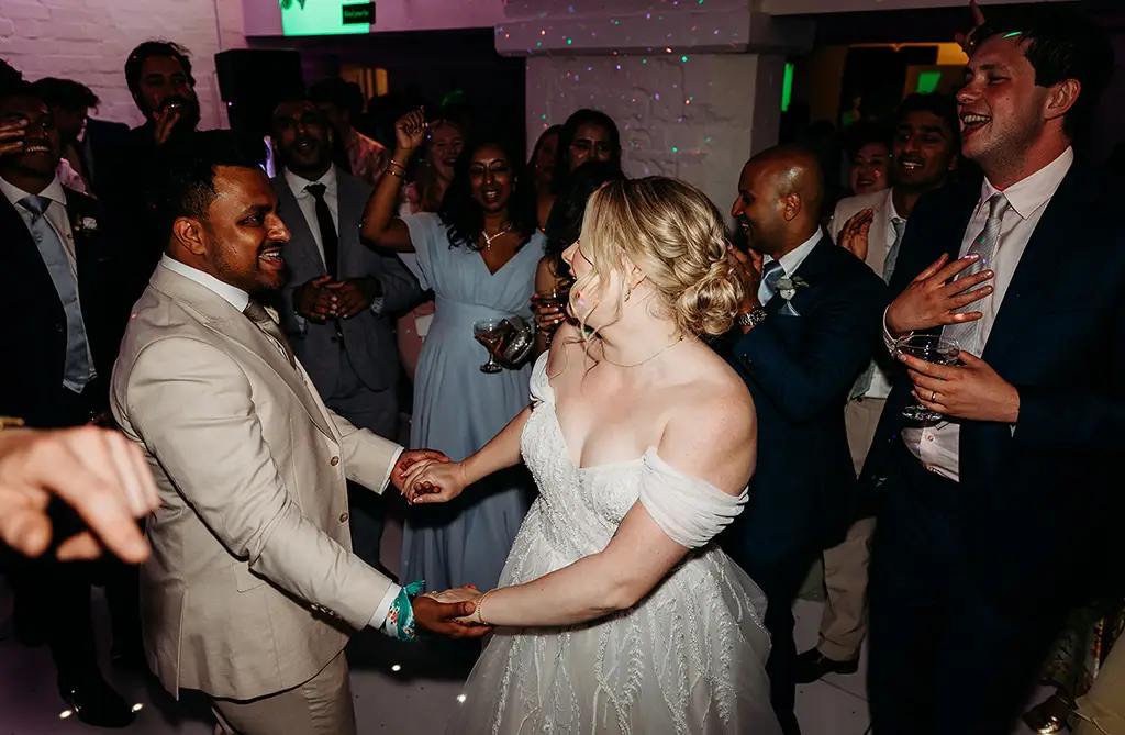 Fran and Ronit dancing with wedding guests during their evening reception at Ragley Hall