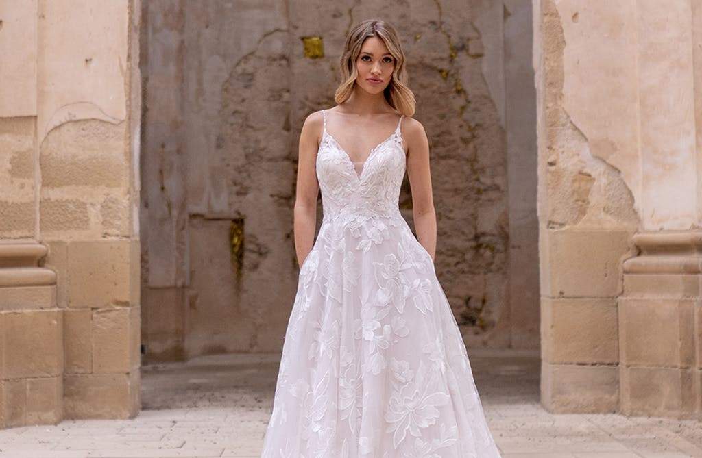 Fashion-forward A-line wedding dress with flowing skirt and modern silhouette