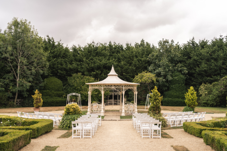 Real bride Lauren at her elegant summer manor wedding