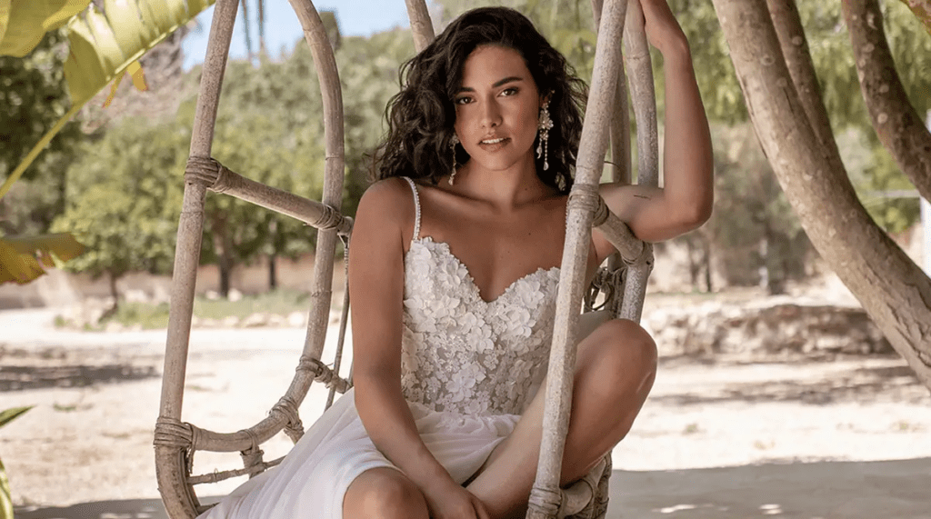 Bride wearing Juniper, a 2027 trend wedding dress by Heidi Hudson