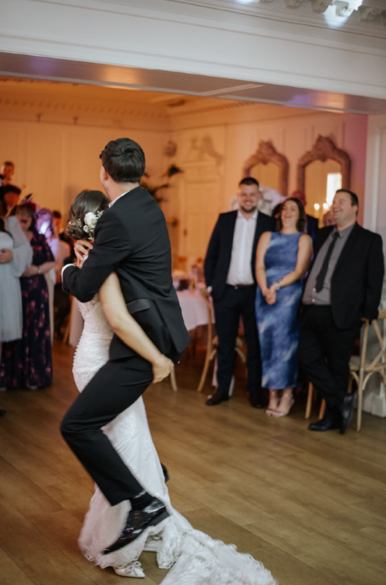 Charlotte lifting Oliver during their first dance