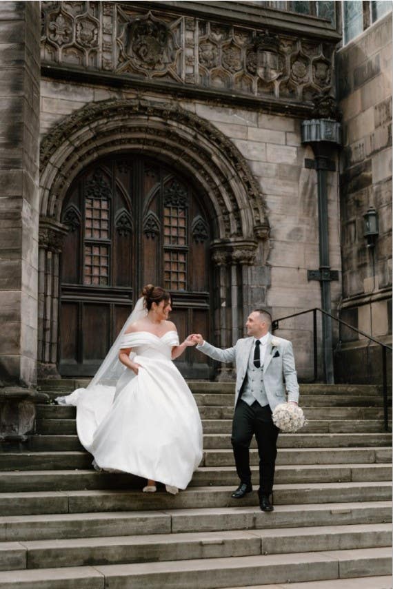 Rachel and Steven walking through Edinburgh after their ceremony