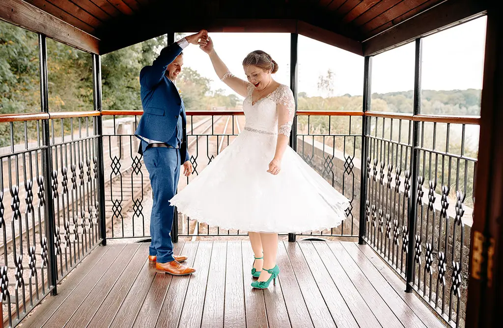 Bride Hannah in a long sleeve wedding dress at a railway venue