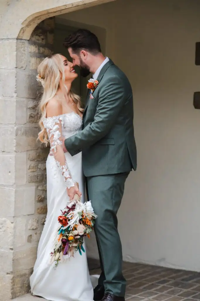 Jaynie and Jack outside their Cotswold wedding venue